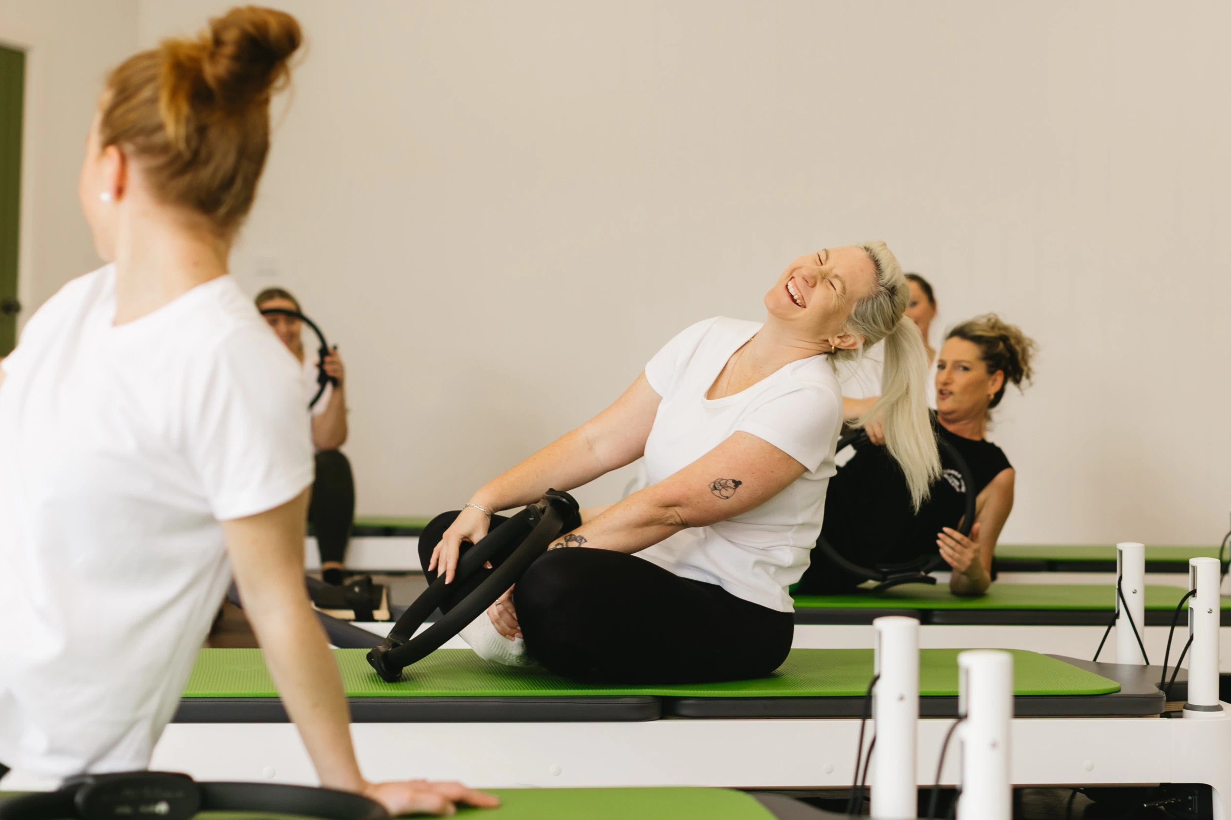 A group mat Pilates class at Naturally Norris Pilates