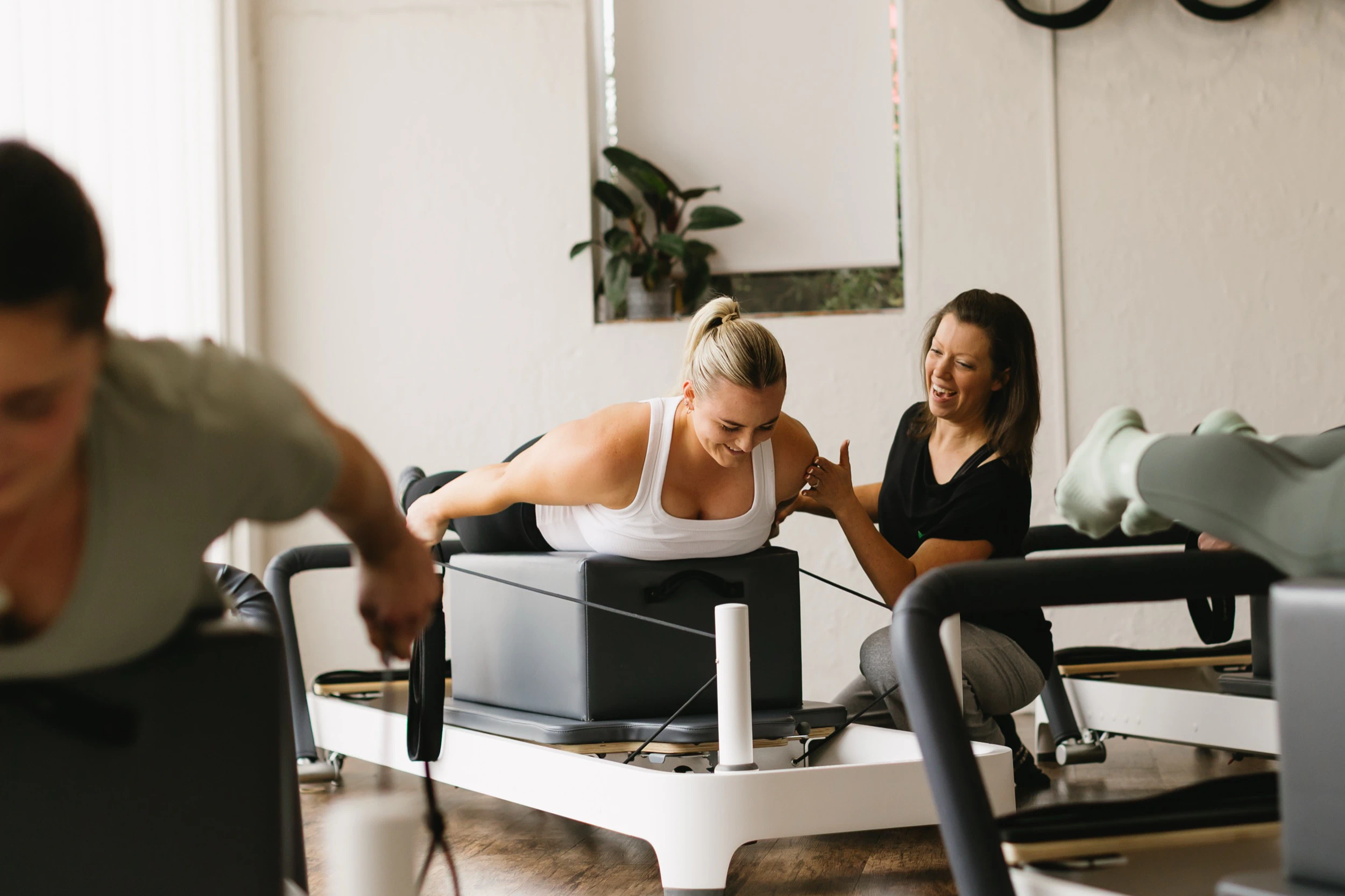 A group Reformer Pilates class at Naturally Norris Pilates